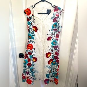 Gorgeous white midi dress with vibrant floral pattern on the sides. Size US 10.